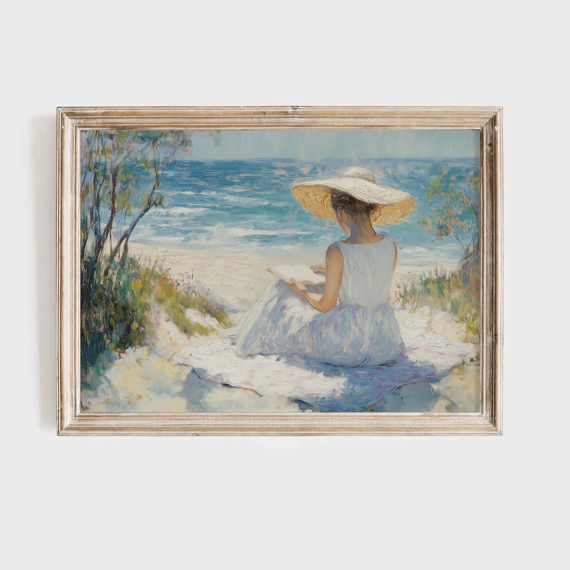 Woman in a Straw Hat Reading on a Beach Facing the Blue Ocean Poster