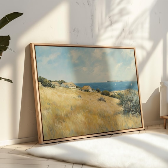 Sunlit Coastal Cottages With Sailboats on a Bright Ocean View Poster