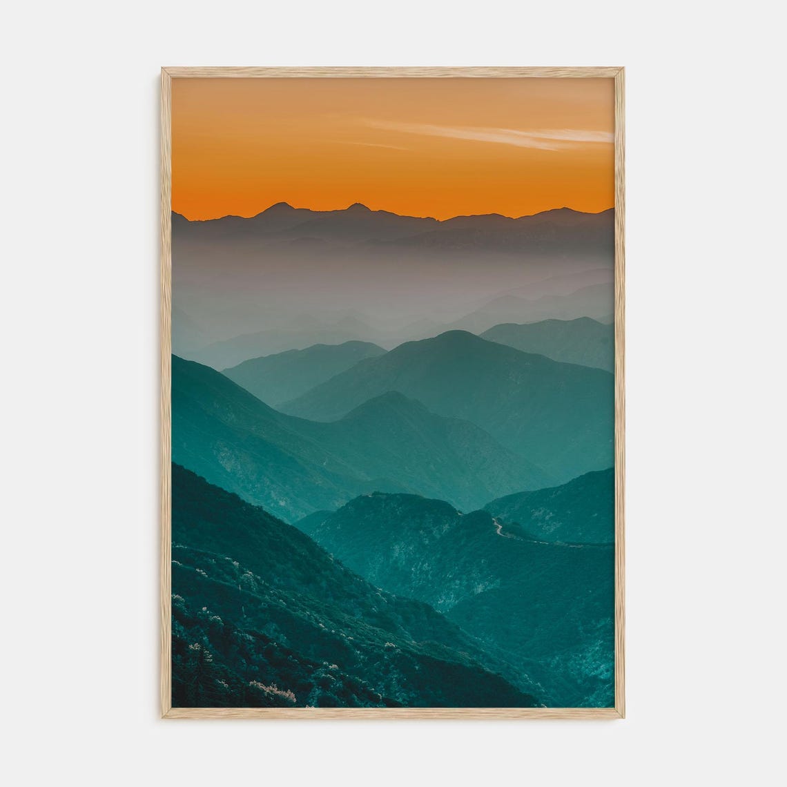 Layered Mountain Ridges Under Fiery Orange Sunset Sky Poster