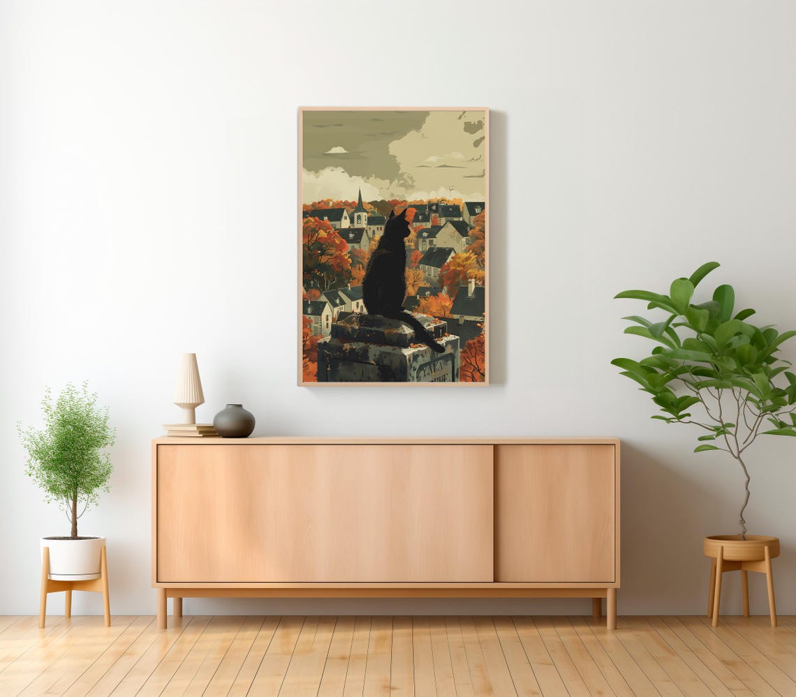 Black Cat Sitting on a Tombstone Above an Autumn Village Art Poster - Image 2