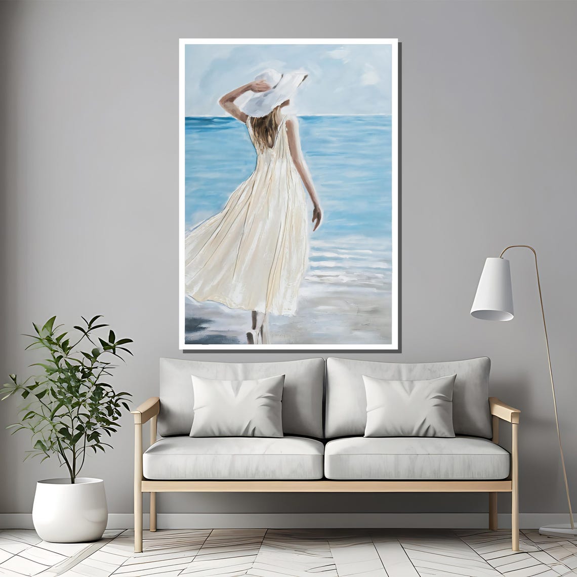 Woman in White Dress and Hat Walking on a Tranquil Beach Poster - Image 2