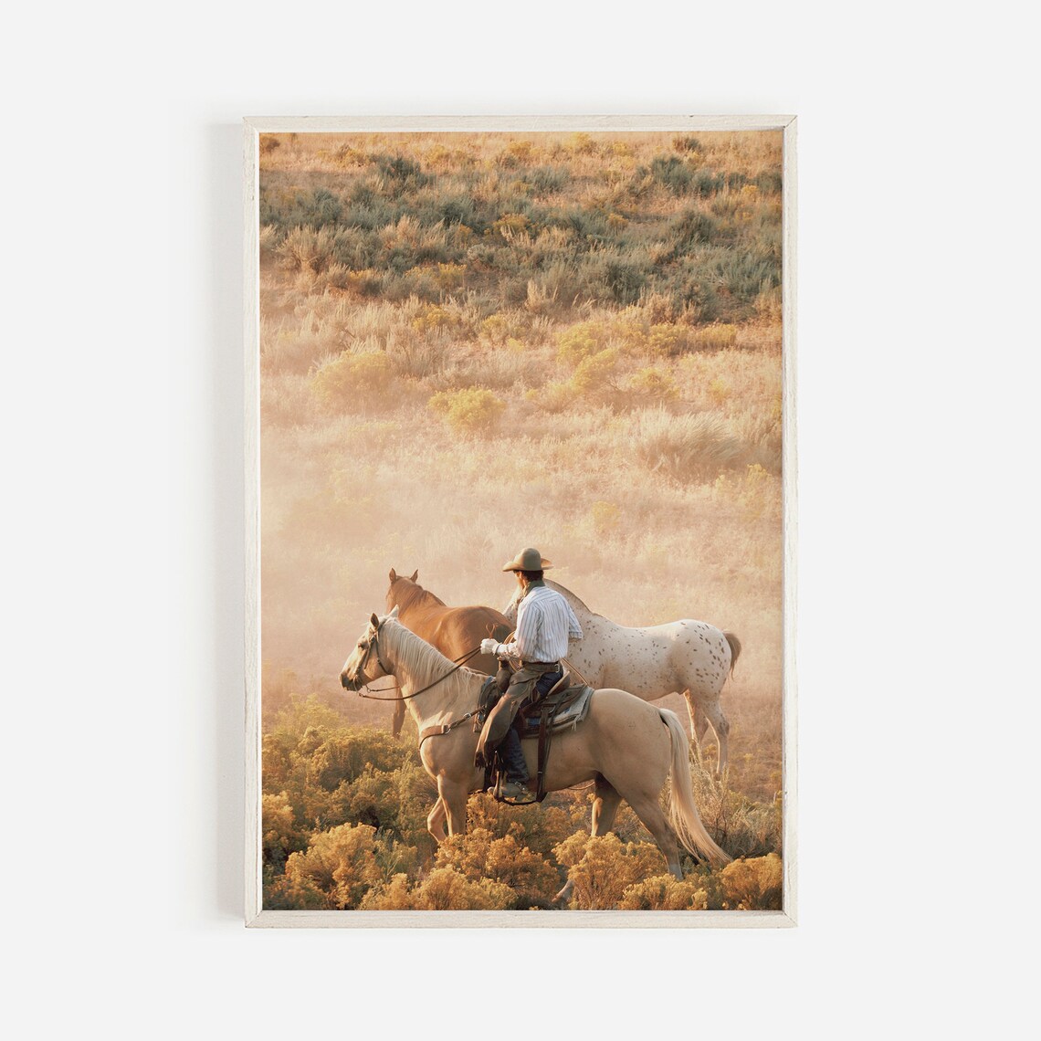 Cowboy On Horseback Rounding Up Horses In Golden Sagebrush Poster