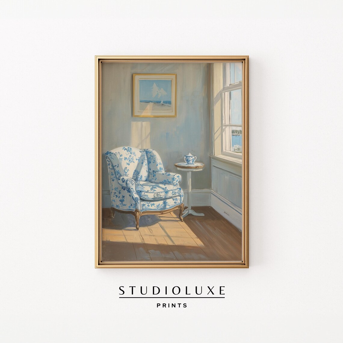 Sunlit Coastal Sitting Room with Blue Floral Armchair and Sea View Poster