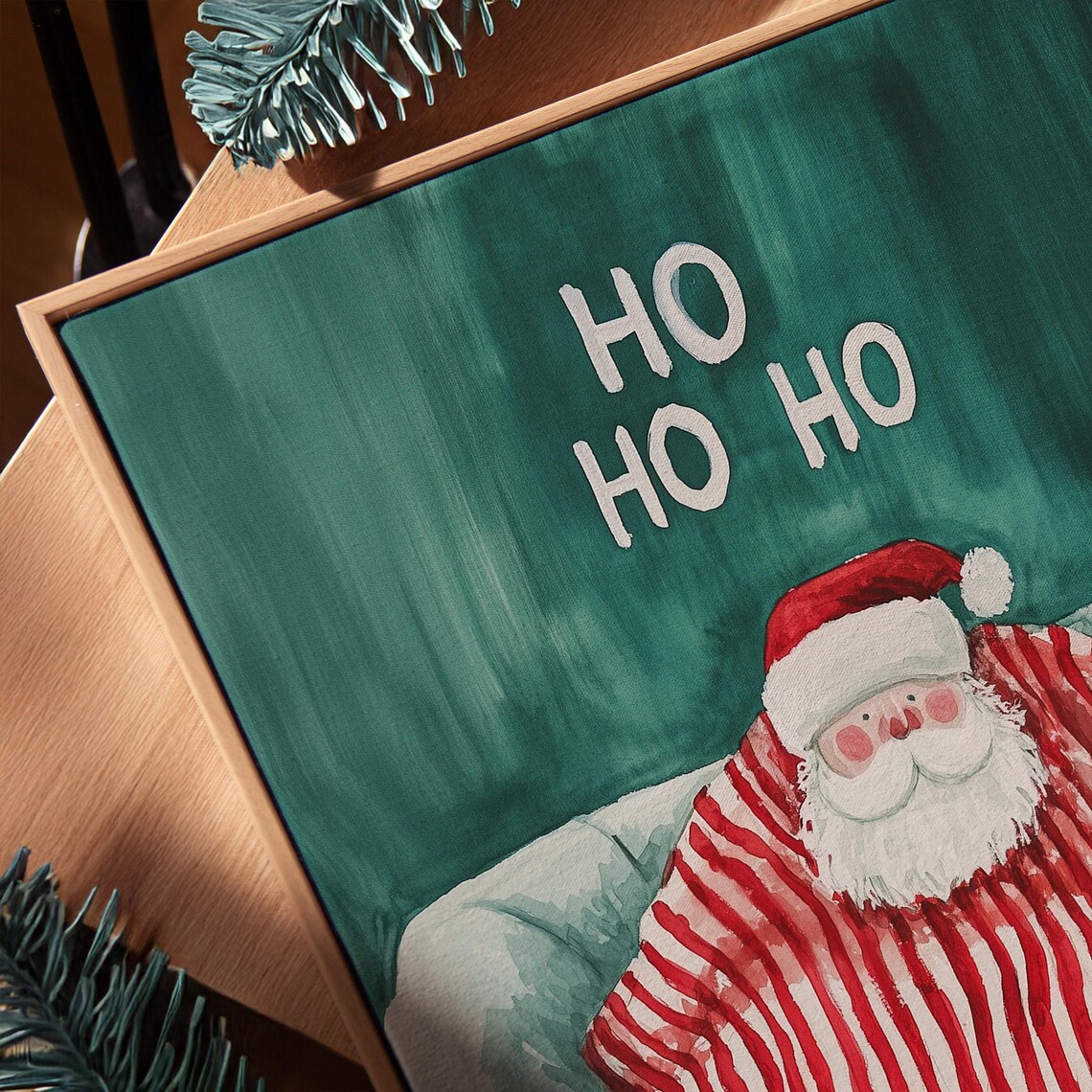 Ho Ho Ho Santa Relaxing on a Couch in a Cozy Green Blanket Poster - Image 3