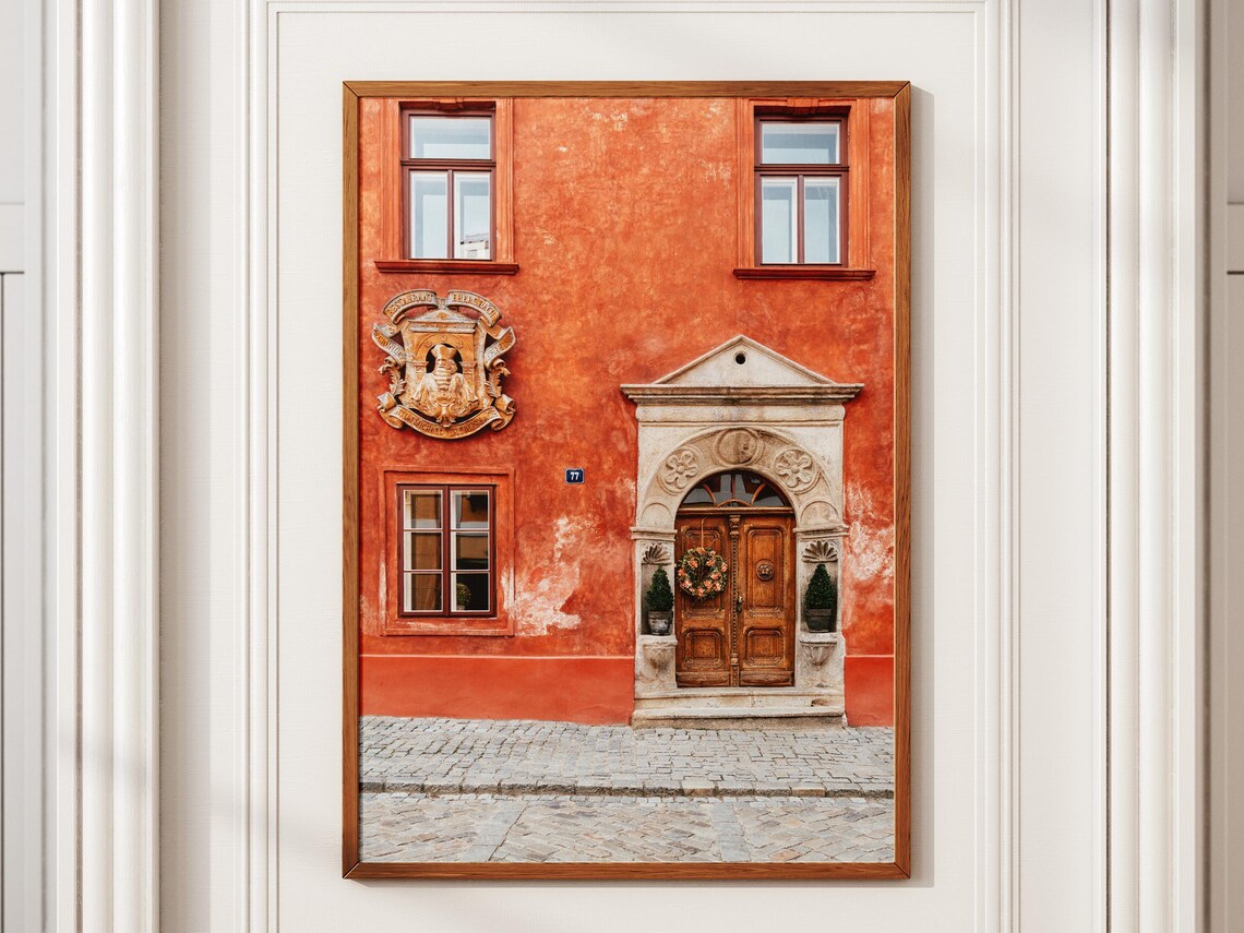 Historic Orange Facade Carved Wooden Door Crest Old Town Europe Poster