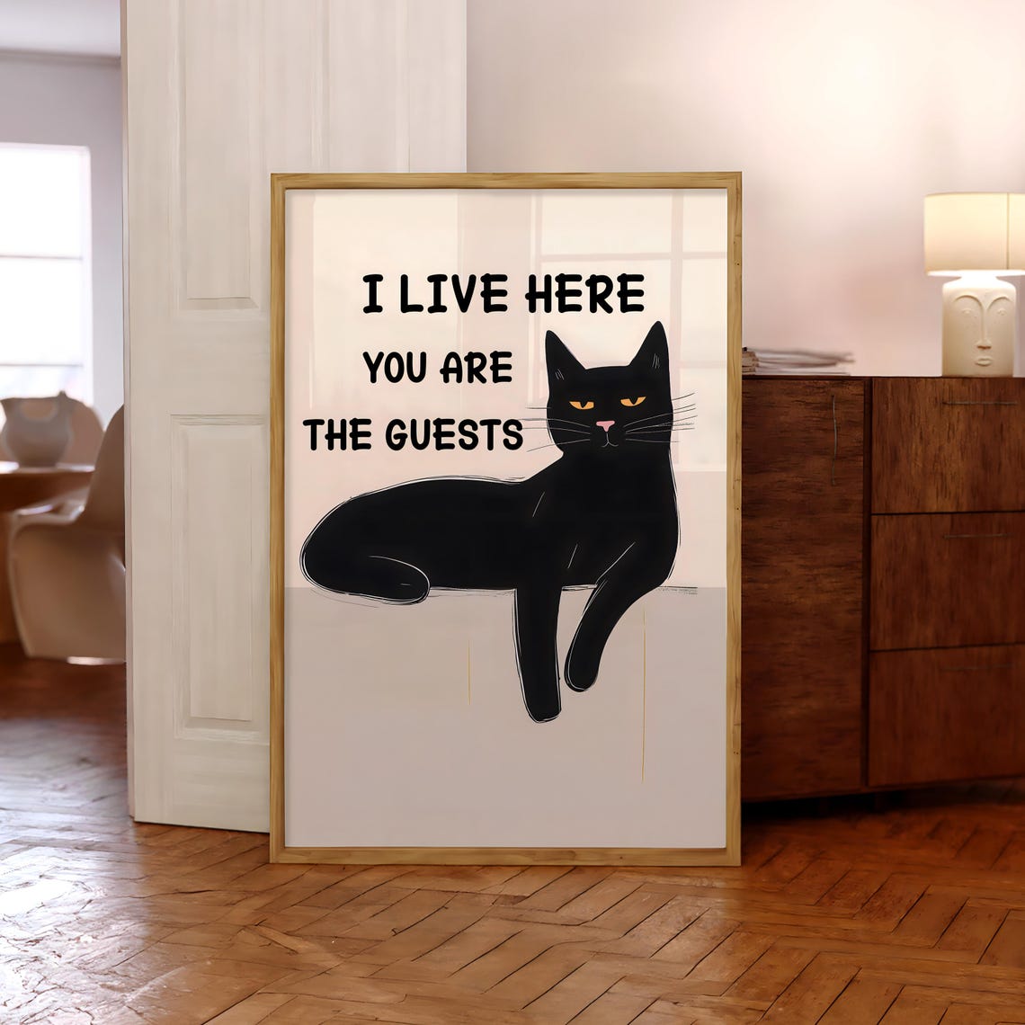 Humorous Black Cat I Live Here You Are The Guests Quote Poster