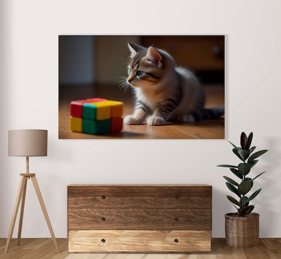 Blue Eyed Tabby Kitten With A Small Rubiks Cube On Wood Poster