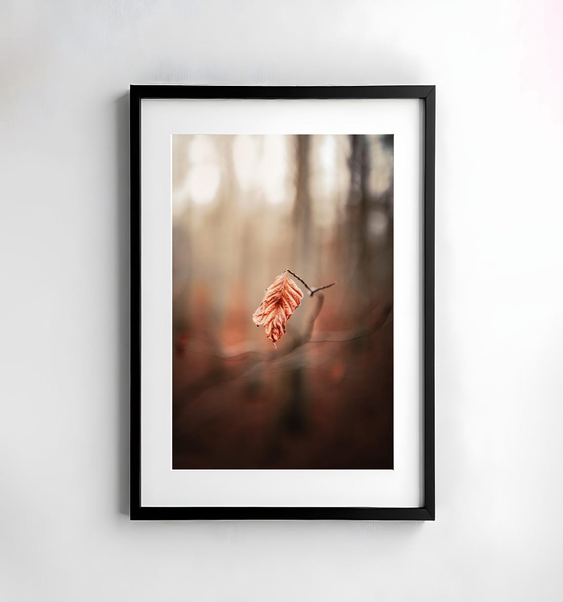 Single Orange Autumn Leaf Hanging on a Twig in Bokeh Forest Poster