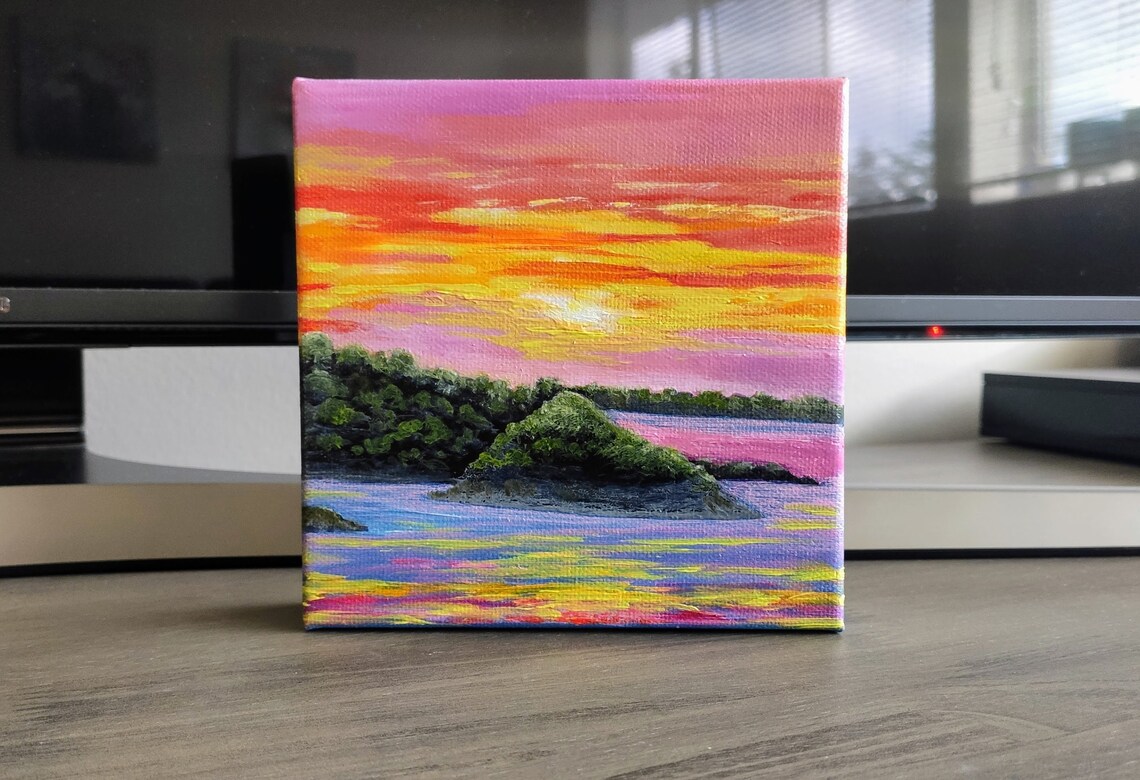 Pink Orange Sunset Sky Over Water With Green Island Rocks Art Poster